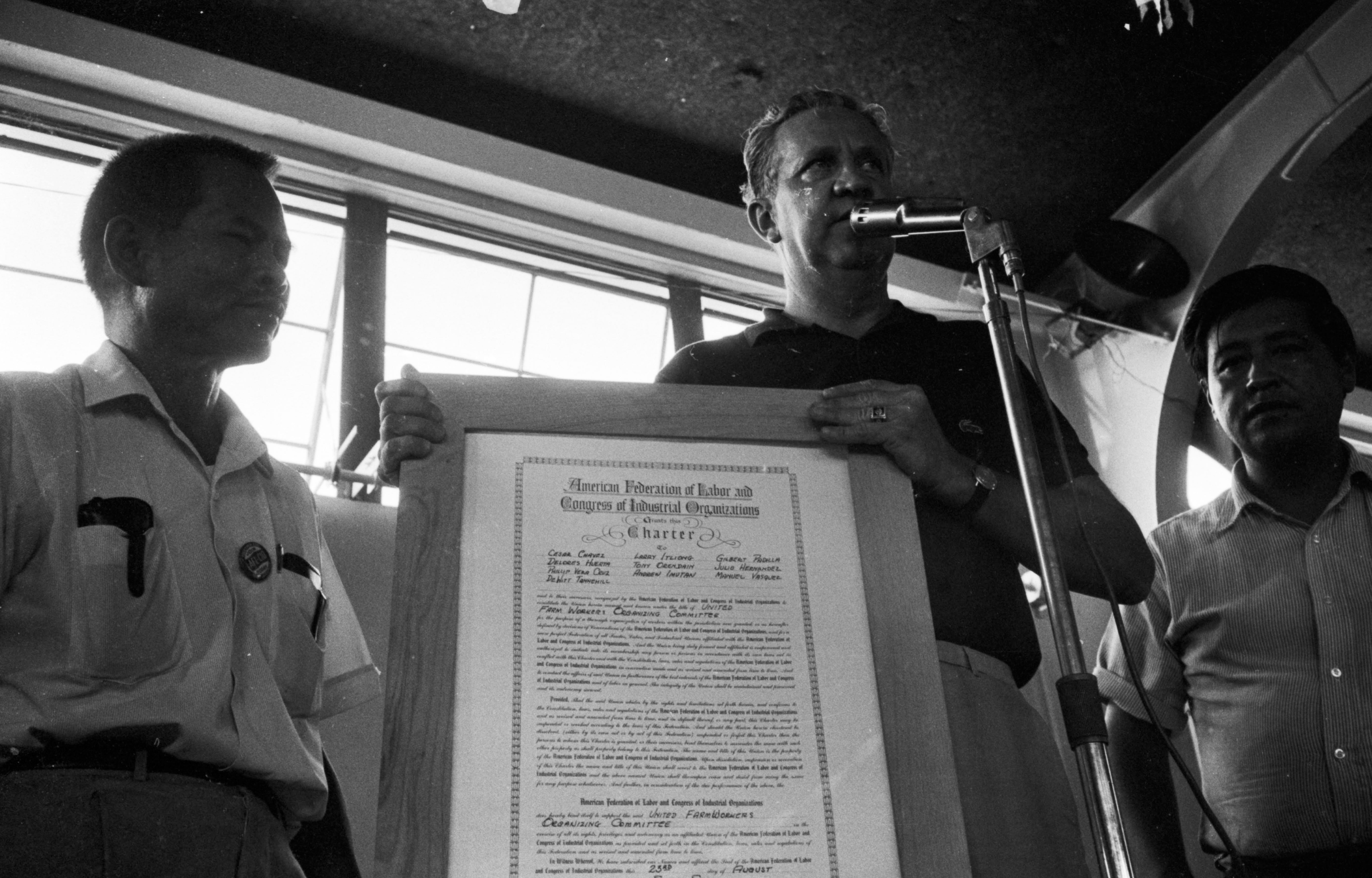 Bill Kircher presenting the UFWOC charter to César Chávez and Larry Itliong, Delano, 1966