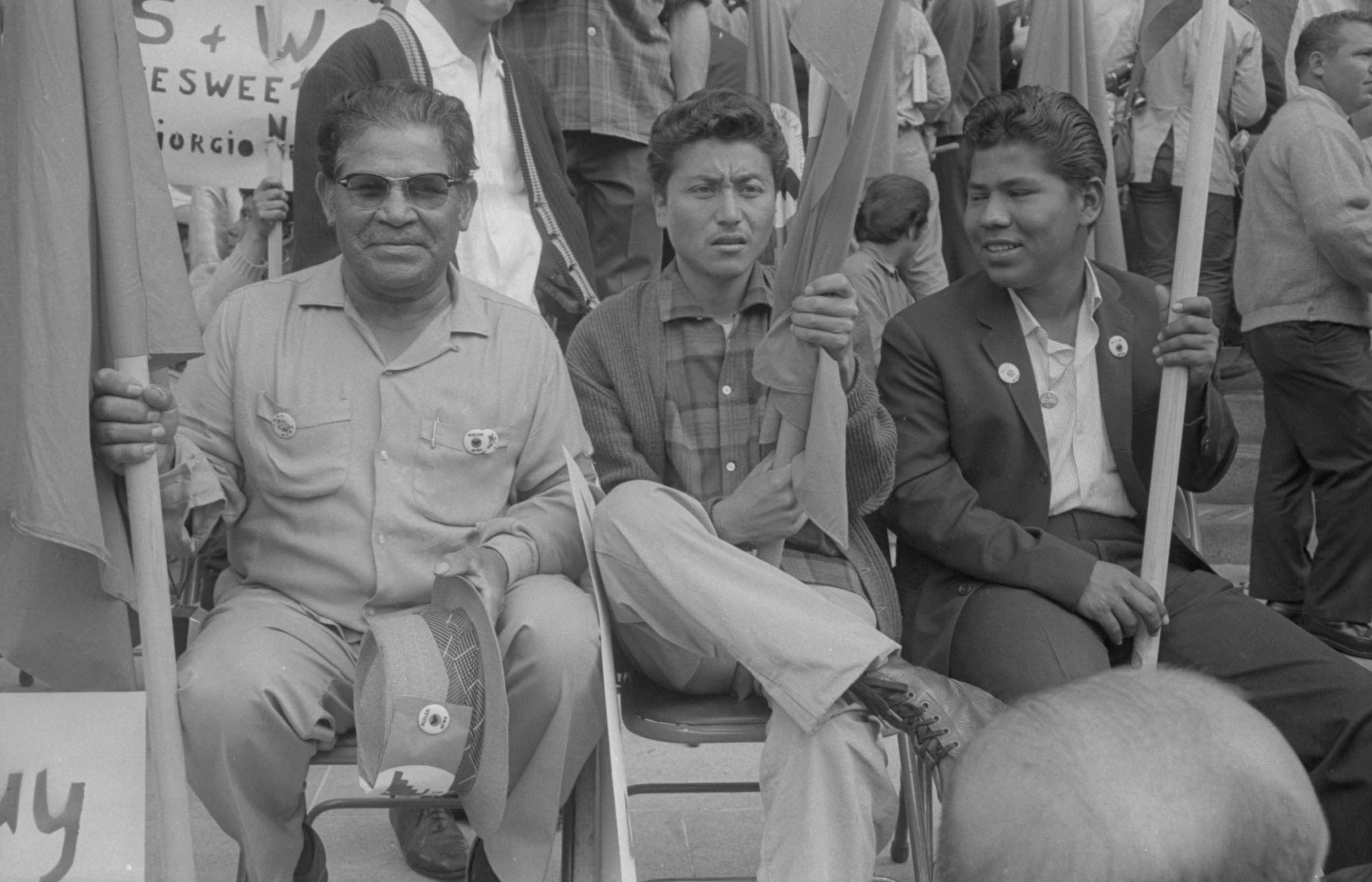 Macario Garcia, Paul Esparza, and Tomas Escalante sitting in front of the State Capitol, Sacramento, 1966