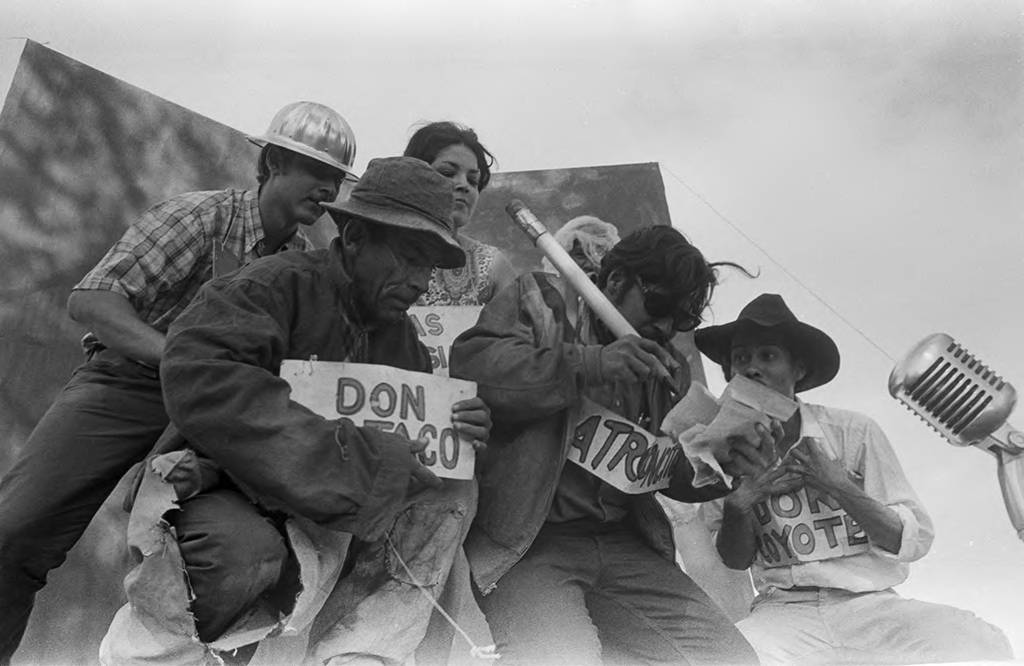 Felipe Cantú, Luis Valdez, Agustín Lira, Doug Rippey, Clarisse Luna, and Daniel Valdez performing on a flatbed truck, Salinas, ca. 1966